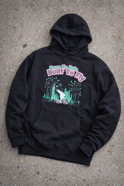 Black hoodie with graphic design and text on a concrete surface